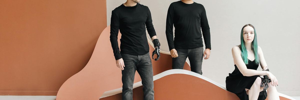 Group of men standing in a modern studio space